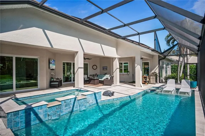 Step outside to your private outdoor oasis featuring a stunning SALTWATER POOL AND SPA BUILT IN 2021 with a tanning shelf