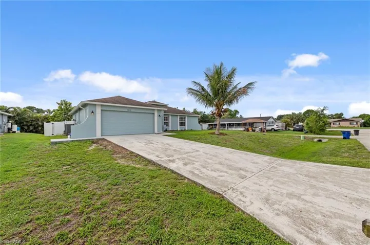 Concrete driveway leading to a two-car garage