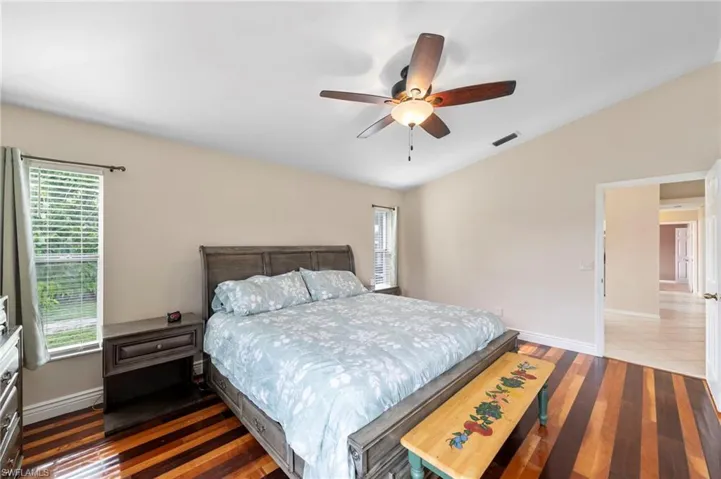 Vaulted ceiling with a ceiling fan featuring integrated lighting