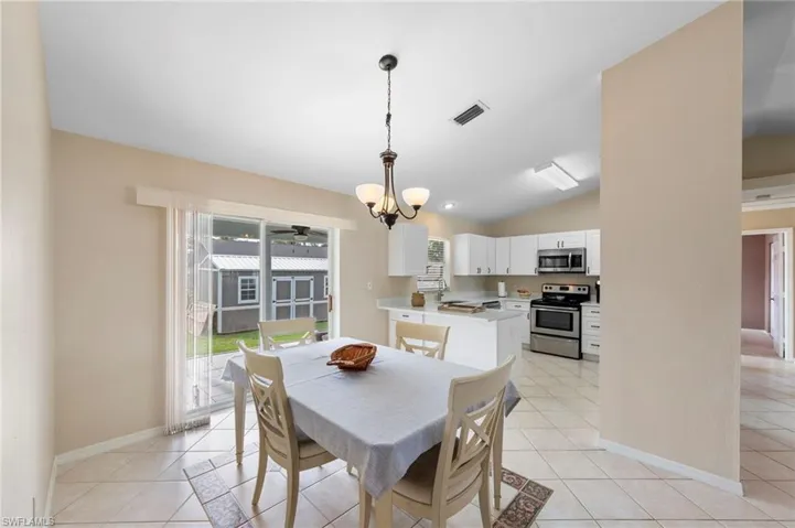 Tile flooring throughout the dining area and kitchen