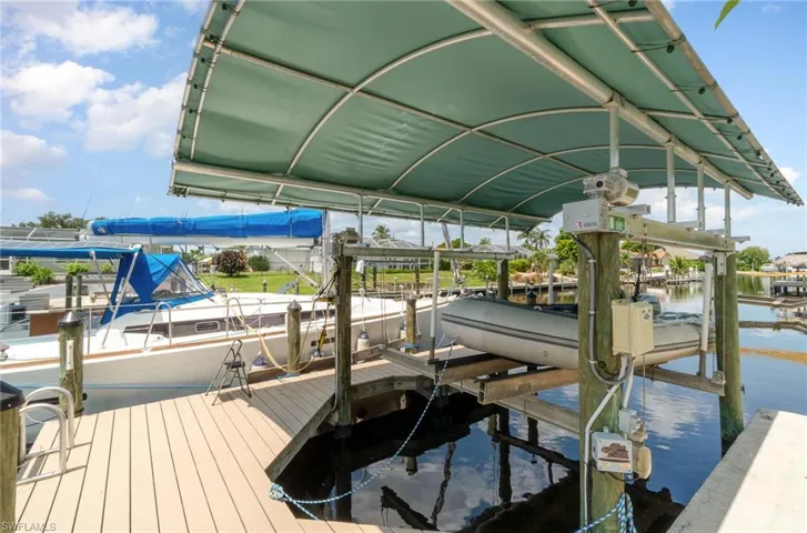 Dock area featuring a water view