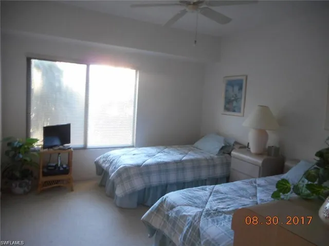 Bedroom featuring carpet floors and ceiling fan