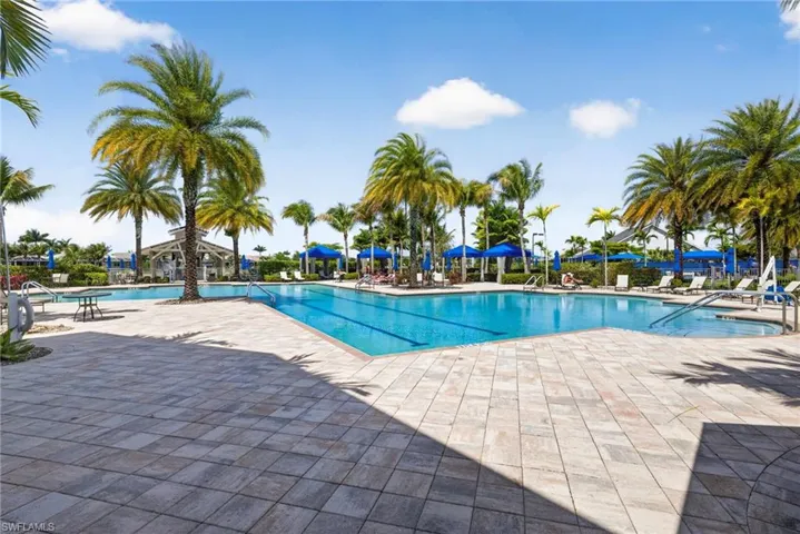 Community pool with a patio