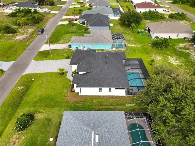 Aerial perspective of suburban area with a pool area