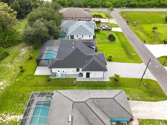 View of subject property with a pool area