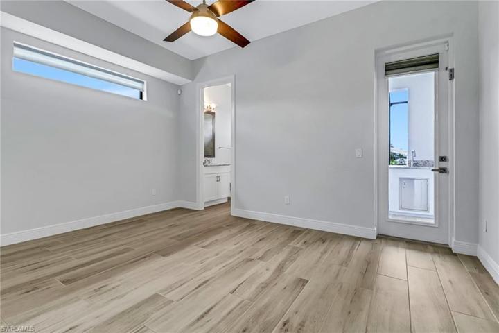 3rd bedroom w/ on suite bath and access to the pool and lanai. Notice the transom window offering natural light and privacy.