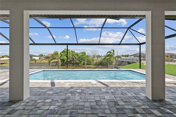 Outdoor pool featuring a patio area and a lanai