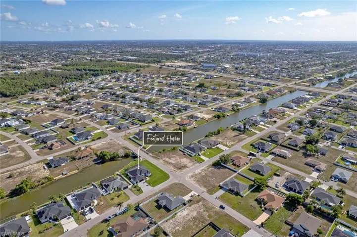 View of property location featuring nearby suburban area and a large body of water