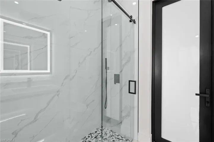Full bathroom featuring a marble finish shower