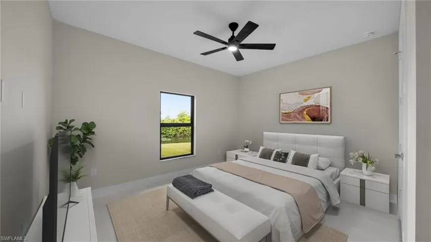 Bedroom featuring a ceiling fan and baseboards