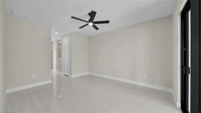 Unfurnished bedroom with ceiling fan and recessed lighting