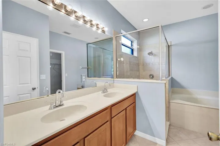 Bathroom with double vanity, and walk in shower