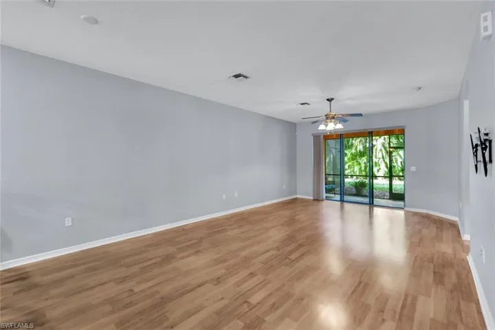 Living Room featuring light wood-type flooring and ceiling fan