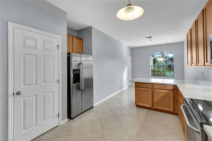 Kitchen looking into Breakfast Nook; featuring a walk in pantry