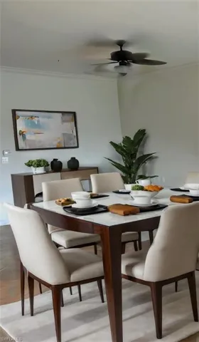 Dining area featuring ornamental molding and ceiling fan