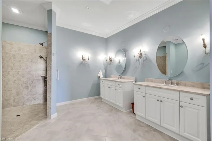 Primary Bathroom with Quartzite countertops an wide shower entry