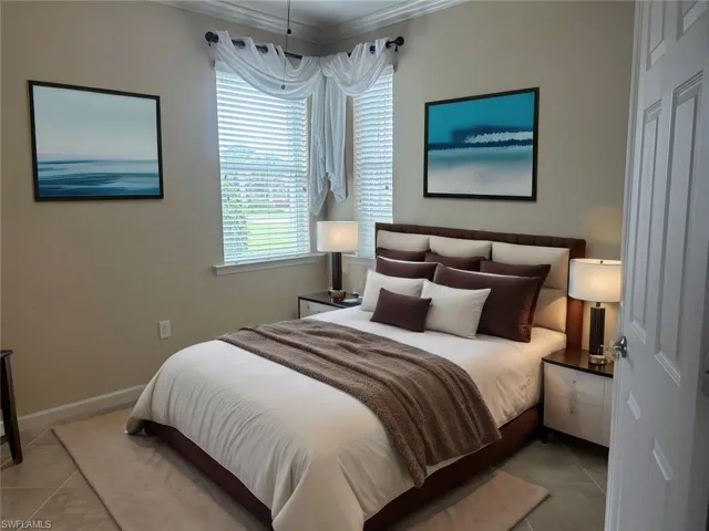 Den virtually staged as a Bedroom with crown molding and light tile floors