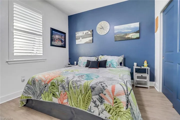 Bedroom with hardwood / wood-style floors
