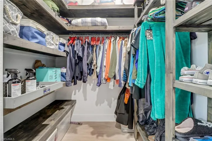 Walk in closet featuring hardwood / wood-style floors