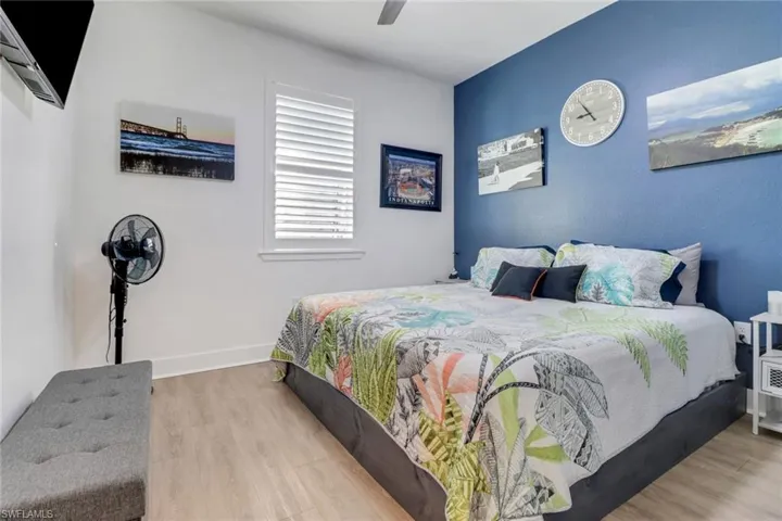 Bedroom with light wood-type flooring and ceiling fan