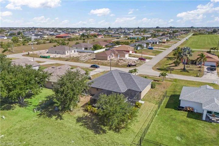Aerial view, the house stands out with its spacious, well-designed layout and meticulously landscaped surroundings.