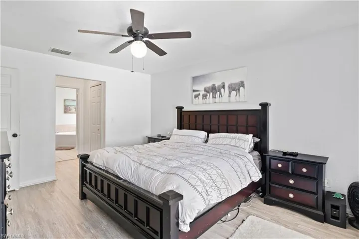 The primary bedroom is a spacious and tranquil retreat, designed for comfort and relaxation.