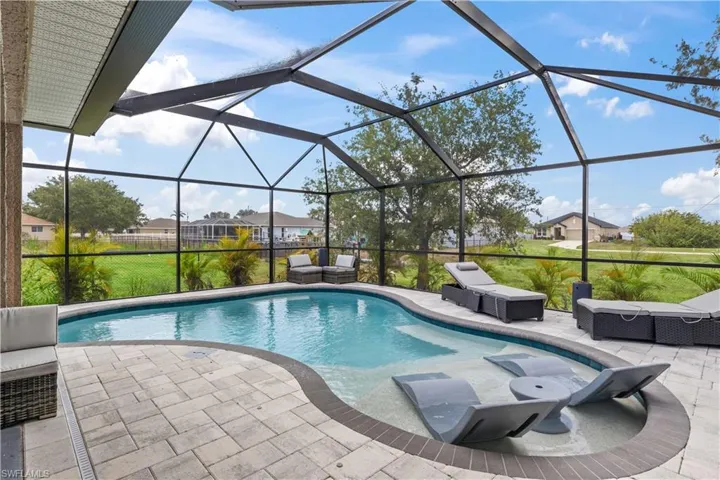 This stunning pool home boasts a sparkling pool, surrounded by lush landscaping and a spacious lanai, perfect for outdoor entertaining or relaxing in privacy.