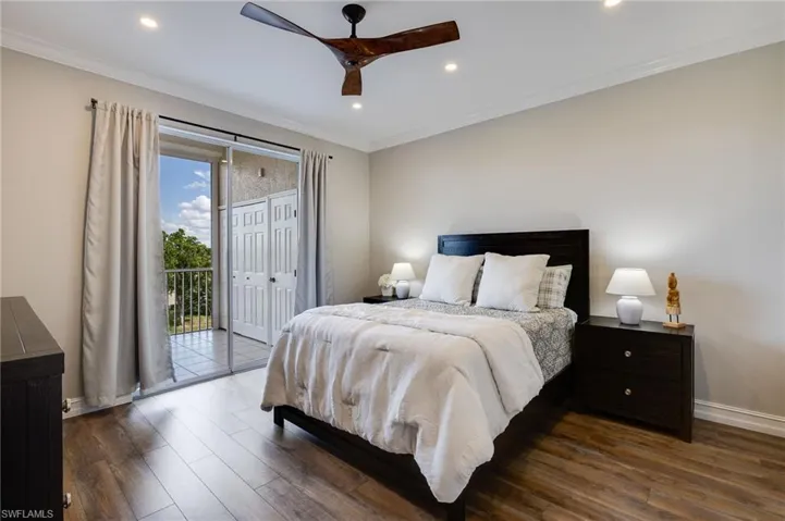 Bedroom featuring dark wood finished floors, access to outside, crown molding, a ceiling fan, and recessed lighting