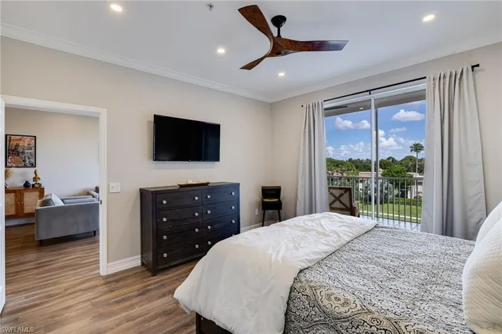 Bedroom with dark wood-style flooring, ornamental molding, access to outside, recessed lighting, and a ceiling fan