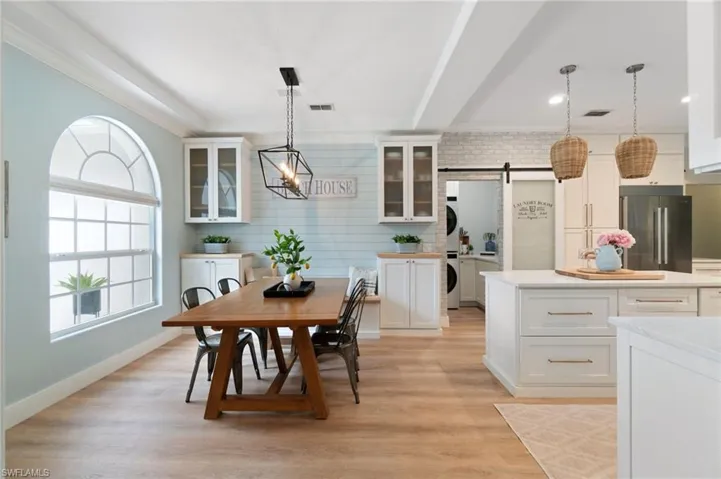 Character is in the details!  Shiplap wall with built-bench, framed by storage cabinets.  Decorative 5 1/2 inch crown molding, and beam ceiling detail adds a stunning touch of craftsmanship