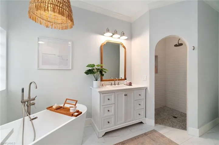 Walk-in shower adorned with custom tile