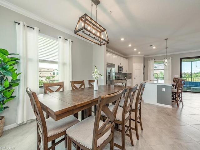 Open floor plan with fantastic dining area and accent lighting fixture, great for casual and formal entertaining