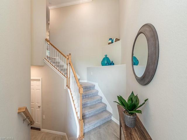Superb tiled foyer with garage access, features an exclusive 1st floor storage room, a perfect way to organize your belongings