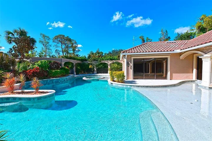 1500 sq feet resort style pool with water features and colored lights