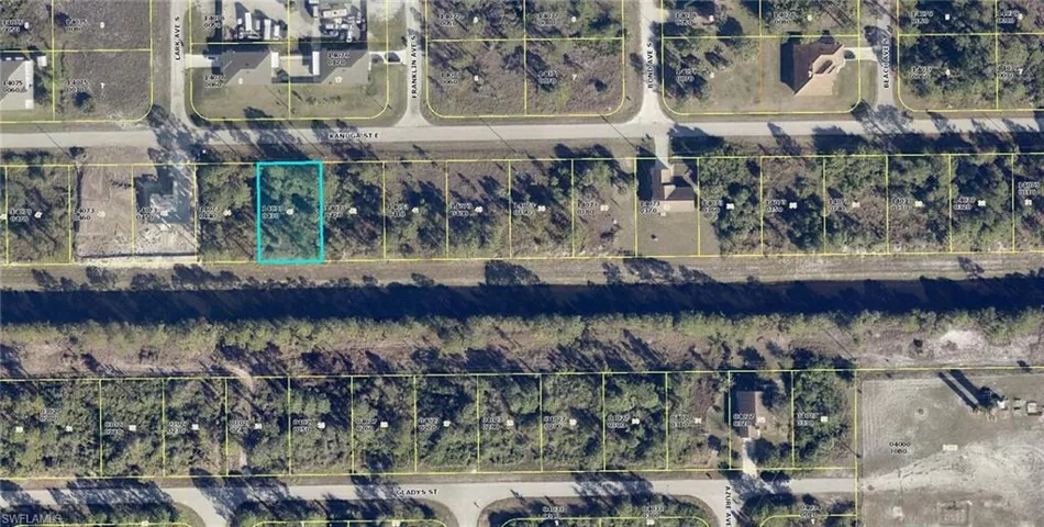 Aerial map of property and surrounding area featuring property boundaries highlighted