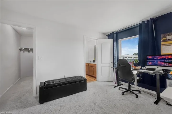 Office featuring light carpet