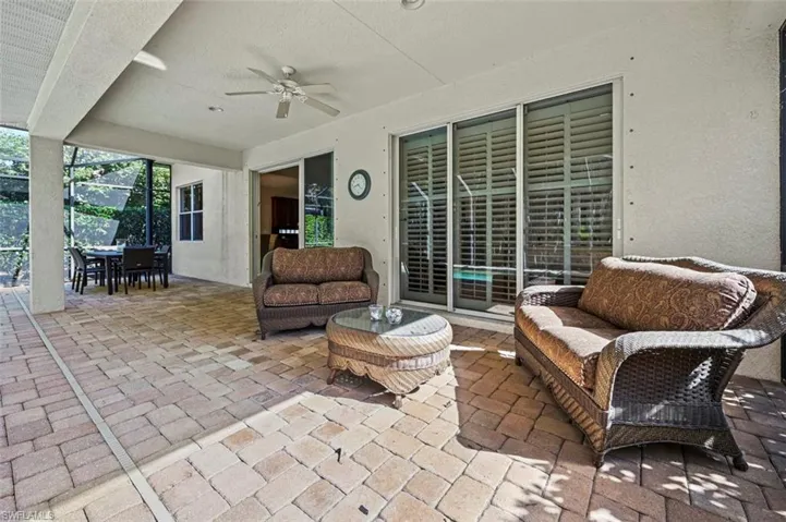 View of patio with an outdoor hangout area, ceiling fan, and outdoor dining area