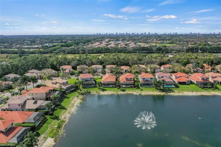 Aerial perspective of suburban area with a nearby body of water