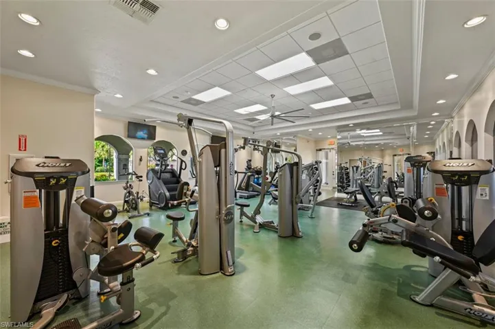 Gym with recessed lighting and a ceiling fan