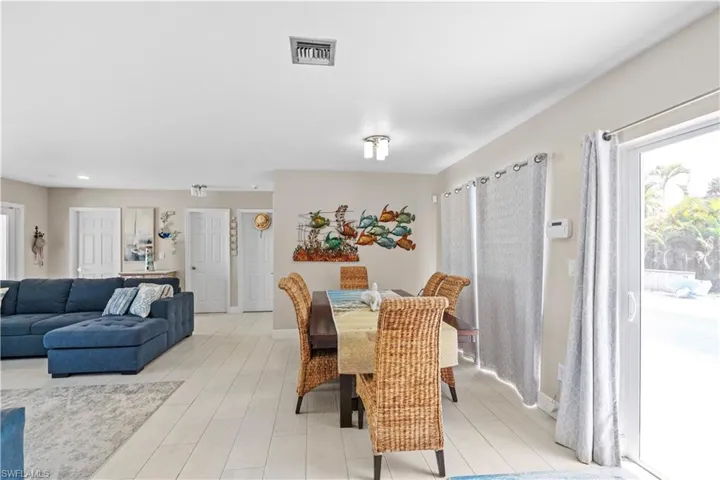 Dining space with baseboards and light wood finished floors