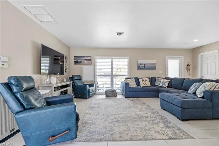 Living room featuring light tile patterned flooring