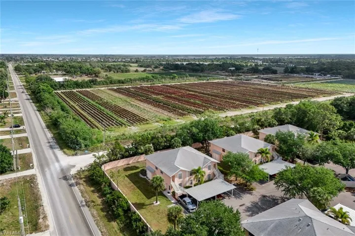 Birds eye view of property featuring a rural view