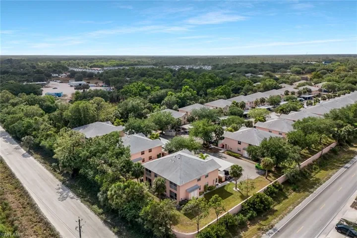 Aerial view with a residential view and a view of trees