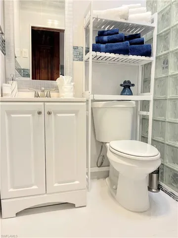 Bathroom featuring light tile patterned floors and vanity
