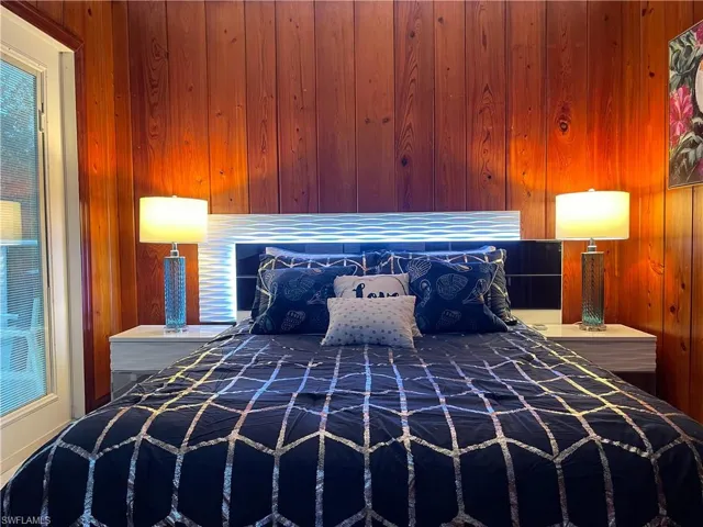 Bedroom with wooden walls