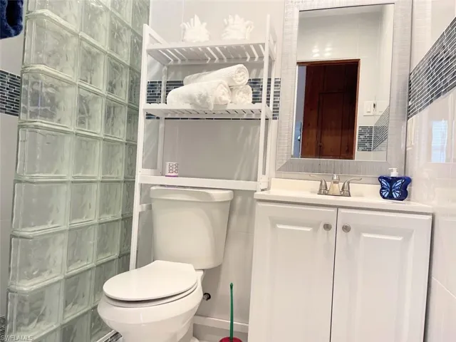 Bathroom featuring vanity and a walk in shower