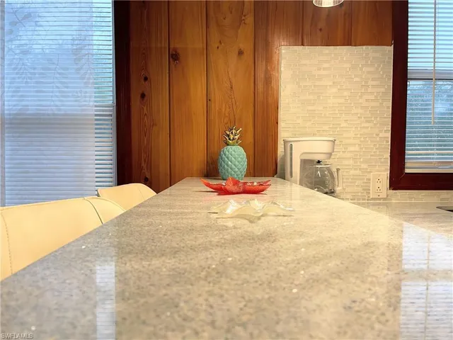 Dining area featuring wood walls