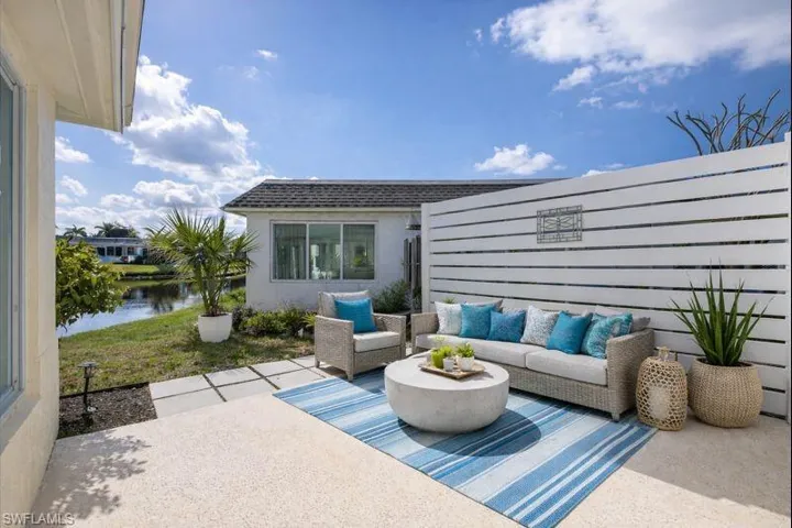 View of patio / terrace featuring an outdoor hangout area and a water view