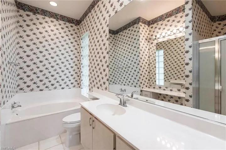 Her side of master bathroom.