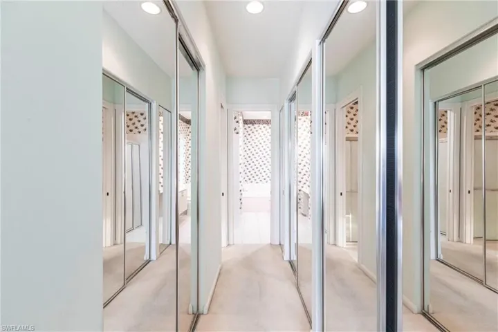 Hall of closets includes a walk-in closet, 2 standard closets, and a linen closet.